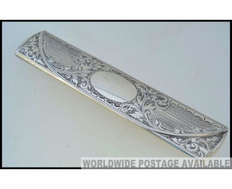 A Victorian silver hallmarked crochet hook case in the form of a spectacle case engraved with sprung mechanism to interior Pa