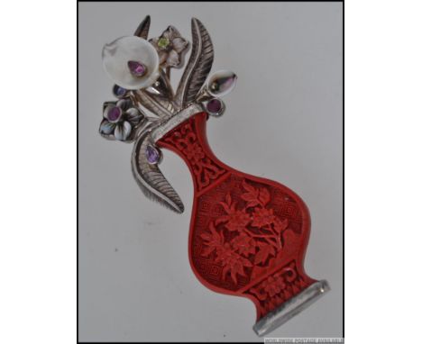 A beautiful Sajen designed silver and coral ladies costume brooch. Highly detailed brooch in the form of a vase of flowers. T