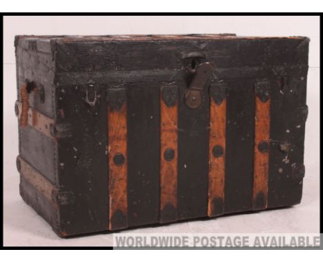 A fabulous 19th century american steamer trunk within canvas and wooden bindings having makers plaque Measures: 56 x 82 x 50.