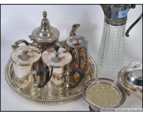 A collection of silver plated items to include part tea service, salver, muffin warmer, cut glass and silver plate collar cla