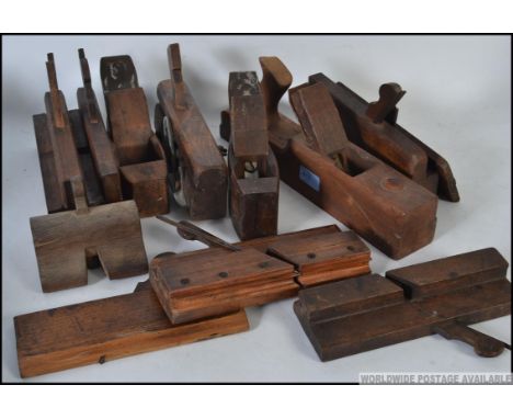 A collection of assorted vintage wooden carpenters planes, box planes etc