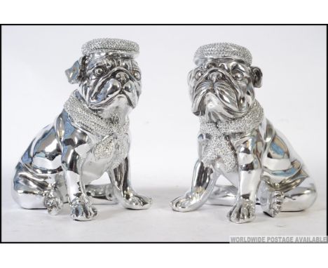 A pair of ceramic chromed bookends in the form of Pug's / Bull dogs, both in a seated position. H20cm