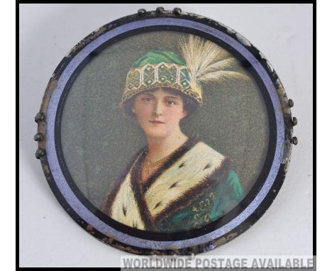 Suffragette Interest. An early 20th century brooch with portrait of a lady, the verso with label having notation ' Mrs Emily 