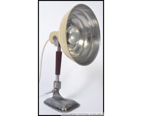A vintage Pifco heat lamp, later converted into a lamp, standing on a shaped base. Measures: 39 x 15 x 38.