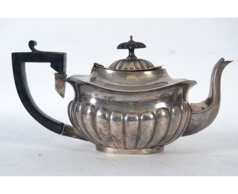 A silver hallmarked teapot bearing hallmarks for Chester by William Aitken, date letter R. Lacking handle, inscribed to top '