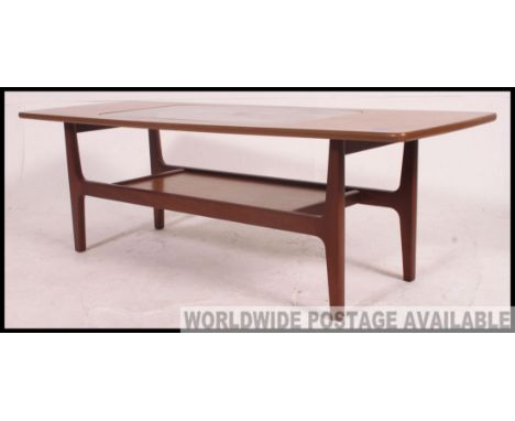 Vintage retro teak rectangular coffee table with inset glass top and under-tier, raised on angular legs united by the under t