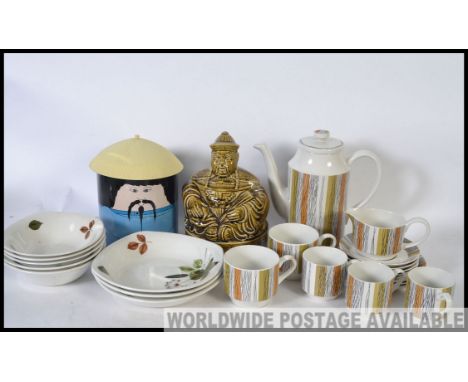 A set of retro Mid Winter coffee service and dishes, a Sadlers Chinaman caddy and a retro tin