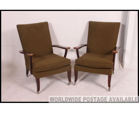 2 vintage Parker Knoll armchairs of Danish influence having angular show wood frames with upholstered seats and back rests Me