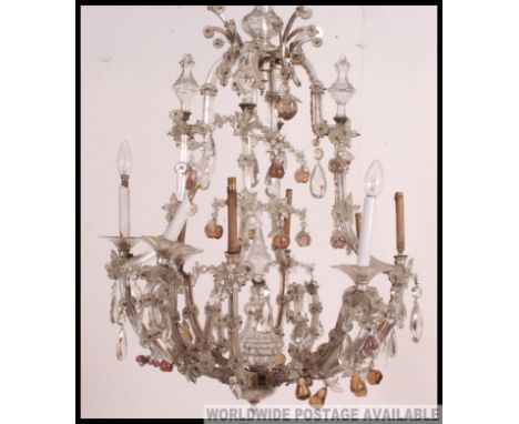 A 20th century vintage large 8 branch glass chandelier. The fabulous 8 branches having glass arms and droplets with finial gl