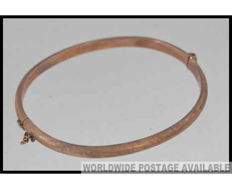 A vintage hallmarked 9ct gold bangle bracelet with clip clasp hallmarked for Birmingham Joseph Smith. Weight 3.8g
