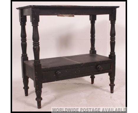 A Victorian ebonised country pine washstand table raised on turned supports with central ceramic washbowl to centre