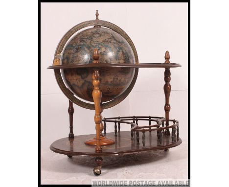 An antique style 20th century globe drinks cabinet trolley. The main  globe with opening hinged top to reveal drinks partitio