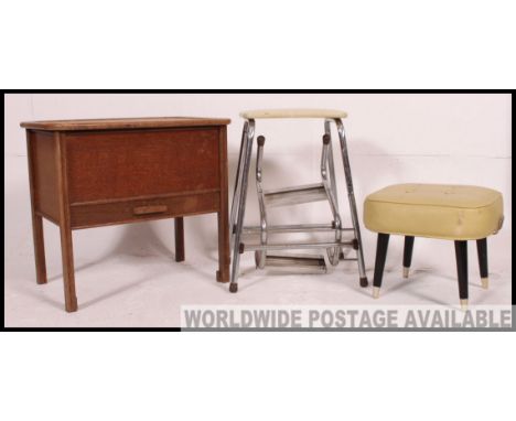 A vintage 1950's hinged top sewing box together with a retro pouffe on dansette legs and a retro yellow vinyl upholstered kit