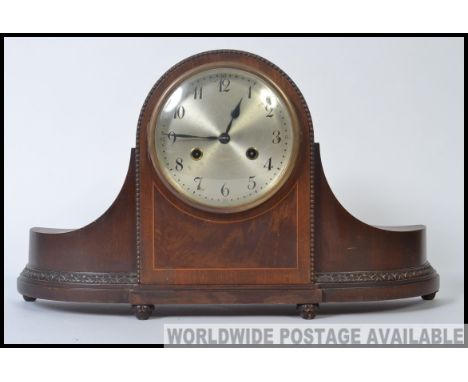 A 20th century Napoleon hat mantel clock having 14 day chime movement in working condition