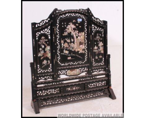 A 19th century mother of pearl and ebony Chinese screen / discretion panel. The mother of pearl inlay to the fret pierced upr