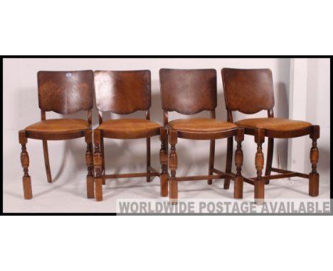 A set of 4 early 20th century Art Deco 1930's panel back dining chairs raised on squared legs with stretchers having drop in 