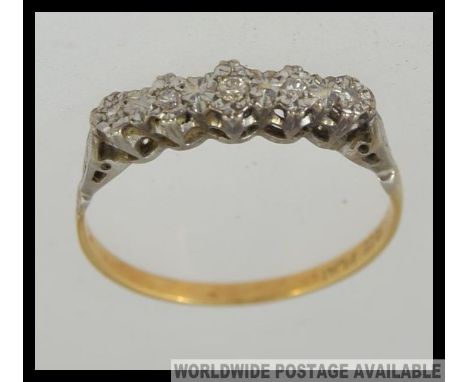 An 18ct gold and platinum vintage ladies diamond ring. The 5 stone setting with approx 10pnts of diamonds, Size R.5 / Weight 