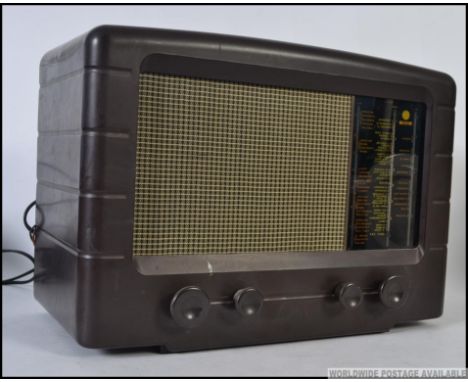 A vintage early 20th century Pye bakelite valve radio with decorative facia