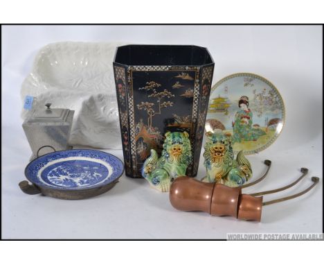 A mixed lot to include a pair of ceramic temple dogs, a retro Japanese tin bin, copper drinks laddles etc