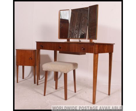 An original Gordon Russell walnut dressing table of five drawers with triple mirror having fabulous sliding trapdoor trinket 