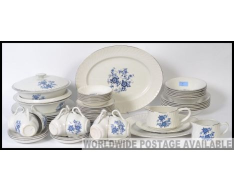 A Wedgwood blue and white royal blue ironstone dinner and tea service comprising cups, saucers, dinner plates etc
