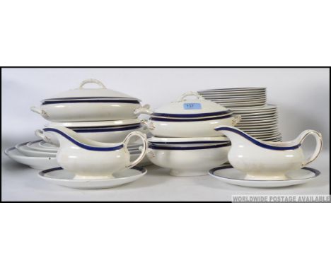 A Bristol Semi Porcelain tea service in blue and white with back stamp to verso. Comprising platters, gravy boat, tureens, di