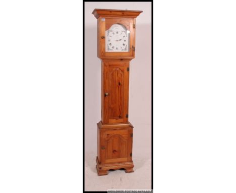 A country pine 20th century Tempus Fugit longcase clock / grandfather clock. The white face with battery movement set verso, 