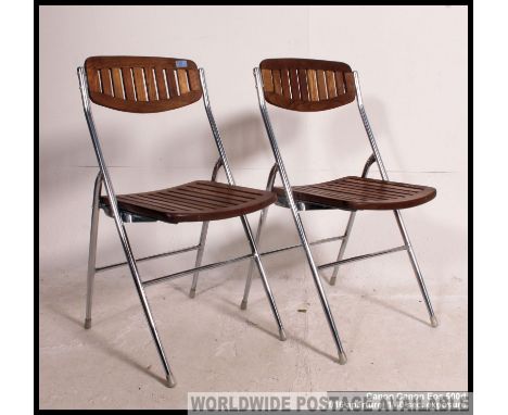 A good pair matching of vintage mid century folding tubular chrome and teak kitchen / garden chairs, having slatted teak seat