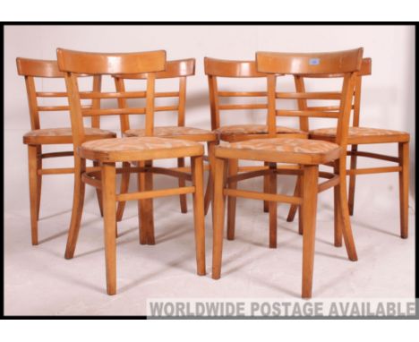 A set of 6 mid century retro / vintage beech wood utility chairs. Raised on squared leg with upper periphery stretchers havin