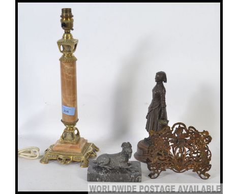 A marble and brass table lamp, Cow and Gate milkmaid dairy figure, marble mounted goat figure and a  filigree letter rack