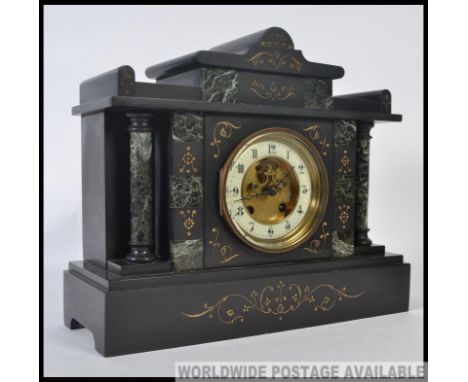 A late Victorian black marble mantel clock of Palladium design having Corinthian column decoration with good decorative clock
