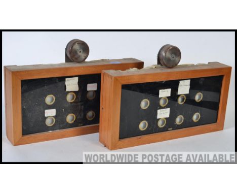 A pair of early 20th century  vintage industrial servant / maid 12 window bell box room indicators by  Gent of Leicester with