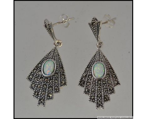 A pair of silver marcasite and opal drop earrings