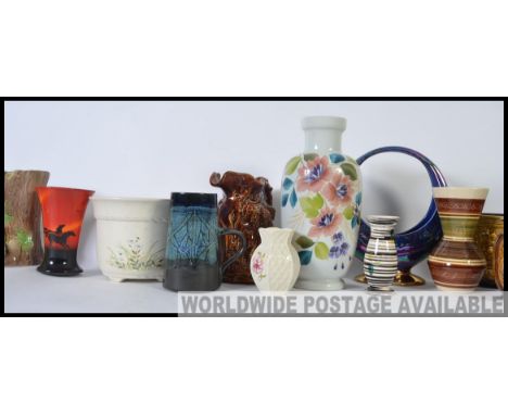 A  collection of Sylvac ceramics to include vases etc. Also Hornsea, Poole Pottery and Price Kensington 20cm