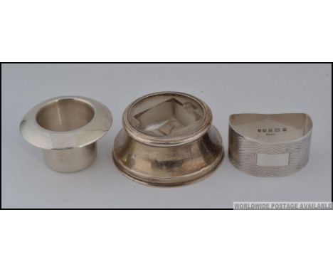 A collection of 3x silver items; An inkwell inner (hallmarked) a hallmarked silver inkwell with glass inner and a hallmarked 