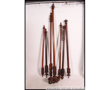 A collection of Victorian mahogany large curtain rails of think form being well carved with finial ends ( 7 total )