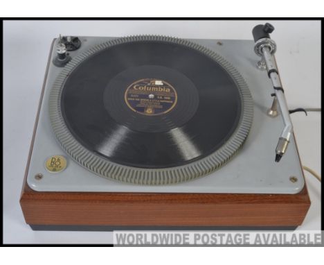 A vintage B&O Bang And Olufsen record deck with acrylic hood dating to the 1970's.