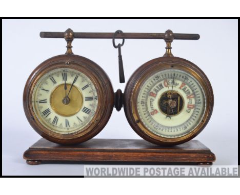 An unusual 1930's oak clock and barometer set. Both pieces jointed on a wooden base, with removable metal handle to top. The 