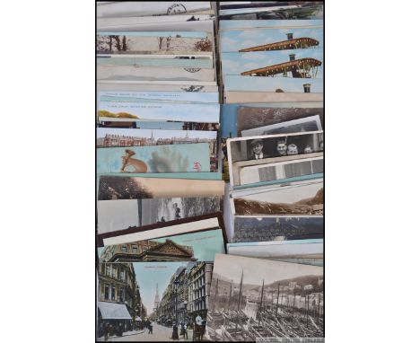 A collection of vintage 20th century postcards of topographical form. Early 20th century Polperro, Swanage, Doncaster and man