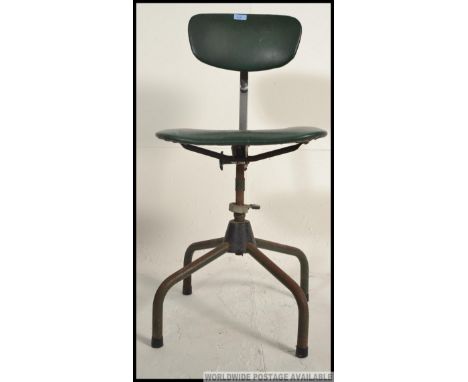 A vintage mid century industrial machinist / draughtmans swivel chair, having a green vinyl seat pad and back rest, being rai