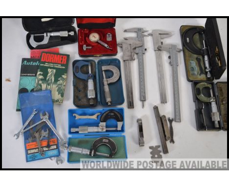 A quantity of vintage engineering tools and gauges etc - to include micrometers, tenths clock, callipers etc. Many within ori