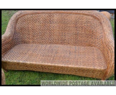 A high quality rattan 3 piece conservatory set with art deco styling (2 chairs + one sofa)