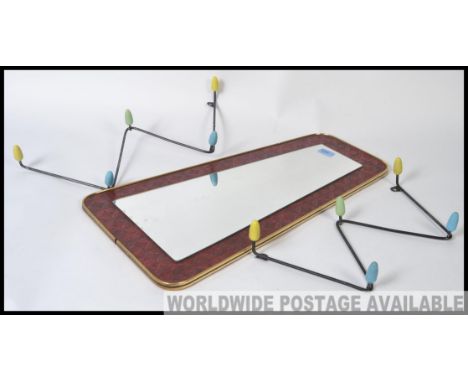 A retro / vintage mid century atomic shaped lozenge wall mirror, along with a pair of retro / vintage atomic coloured wall ha