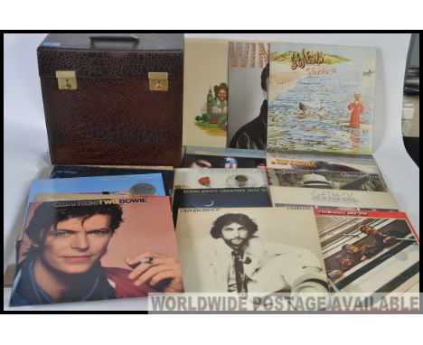 A collection of vintage LP vinyl records and singles to include pop, rock and various genres.