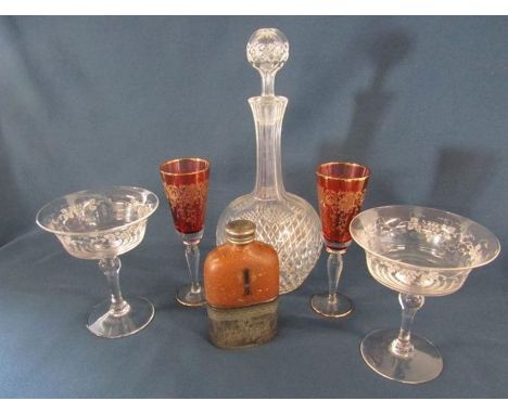 Glass decanter, pair of cranberry glasses, pair of etched glasses and a silver plate and leather covered glass flask