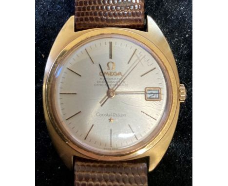 Omega Constellation automatic officially certified chronometer wristwatch in an 18ct gold case with a brown leather strap. Se
