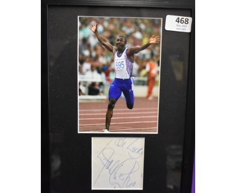 Linford Christie. Athletics. Autograph and photo of Linford Christie. Signed back stage at Granada Studios after filming Ques