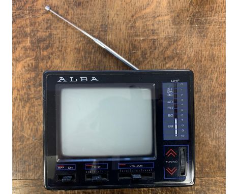 Portable Miniature TV Receiver. Alba PTV-12 4.5 inch Black and White vintage TV receiver, circa 1980s. 12V mains powered, ext