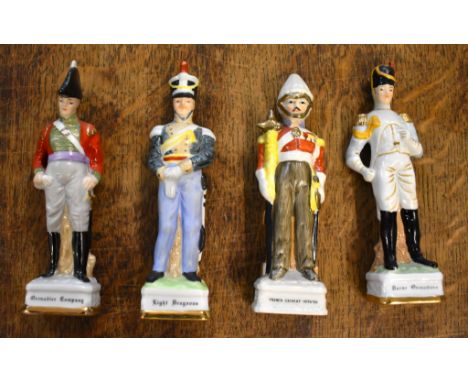 Soldier Statuettes. Collection of bisque / ceramic soldiers (x8). Four soldiers approx 8 inches high. Plus four soldiers appr