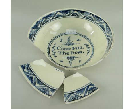 LATE 18TH CENTURY CAMBRIAN POTTERY BOWL decorated in underglazed blue swags and floral tiles to the border interior, centre w